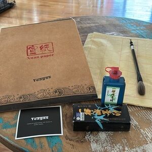 Chinese calligraphy set. Ricepaper, unused brush, and ink included. Barely used.